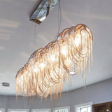 Upside Down Interiors Gold 2base ceiling / L132 W30 H78cm Aluminium Chain Chandelier Creative Tassel LED Light